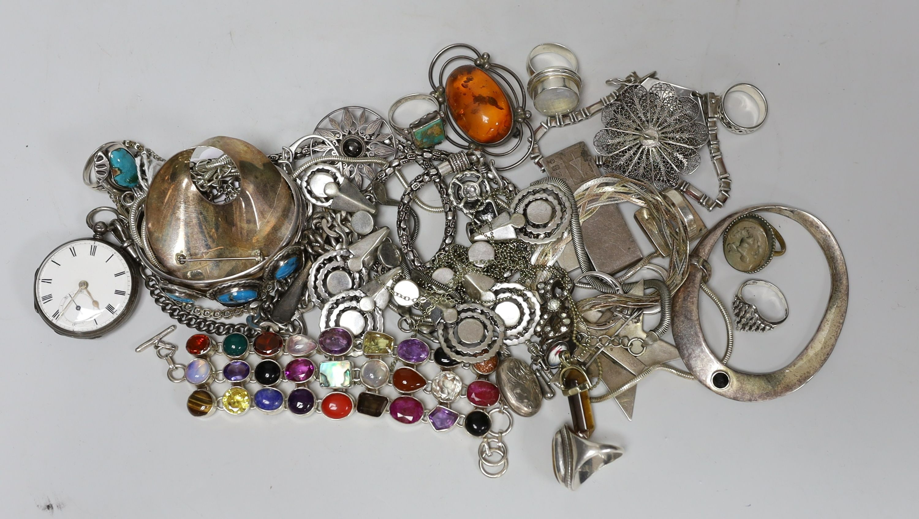 A quantity of assorted silver and white metal jewellery etc. including albert chain with pocket watch, bangles, bracelets, brooches, money clip and rings.